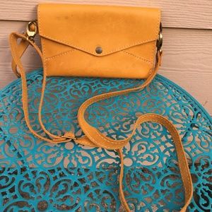 Yellow Portland Leather Goods mini crossbody purse